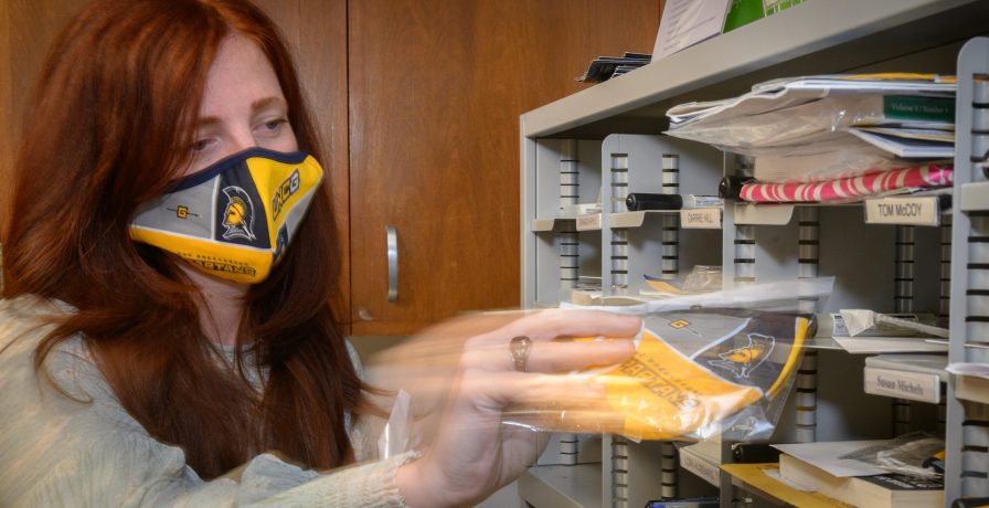UNCG nursing staff member in a face mask